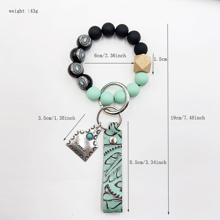 Wholesale Western cowboy style beaded green leather alloy keychain